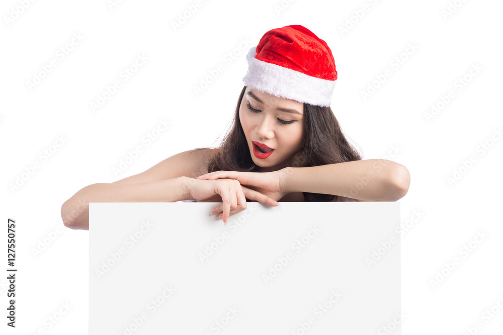 Asian Christmas girl with Santa Claus clothes holding blank sign