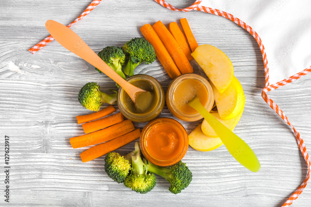 baby vegetable puree on wooden background top view