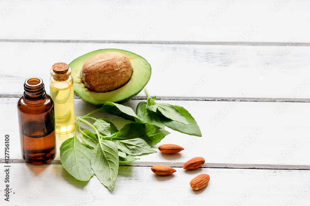 avocado oil for handmade cosmetics on wooden background