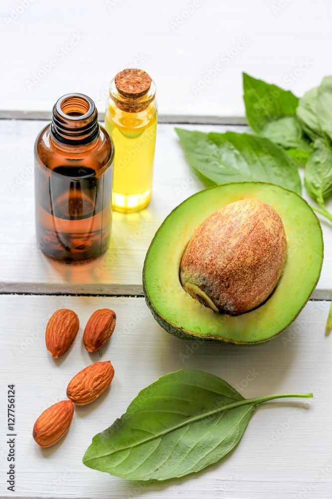 avocado oil for handmade cosmetics on wooden background