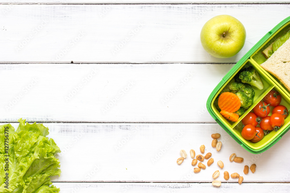 preparing lunch for child school top view on wooden background