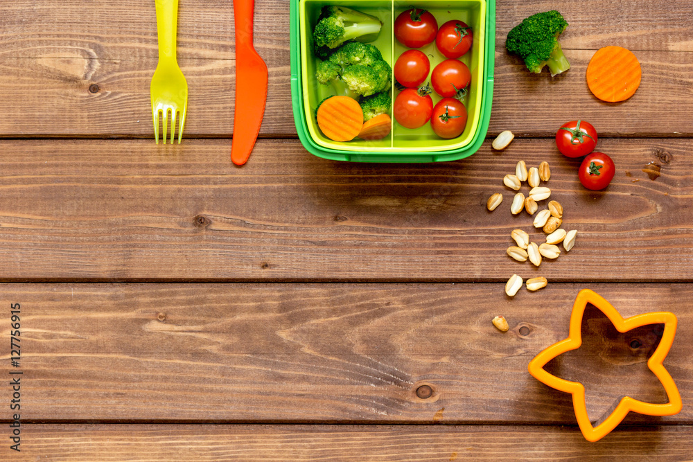 ingredients for childrens lunch on wooden background top view