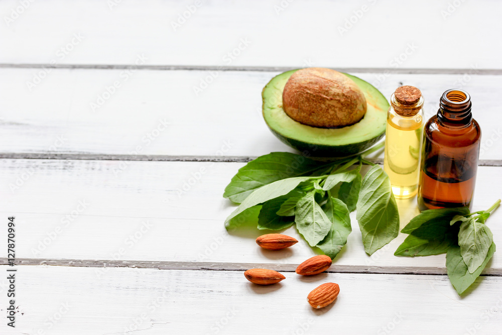 avocado oil for handmade cosmetics on wooden background