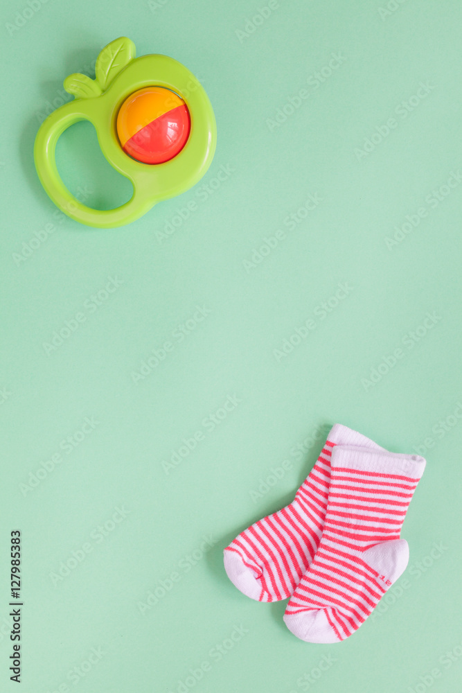 baby rattle on green background