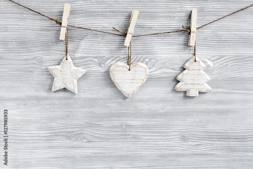 Christmas toys and spruce branches on wooden background top view