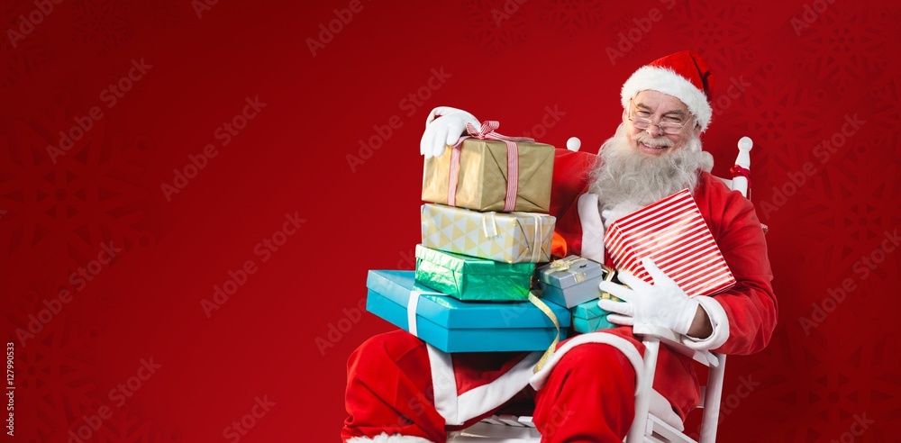 Composite image of portrait of cheerful santa claus