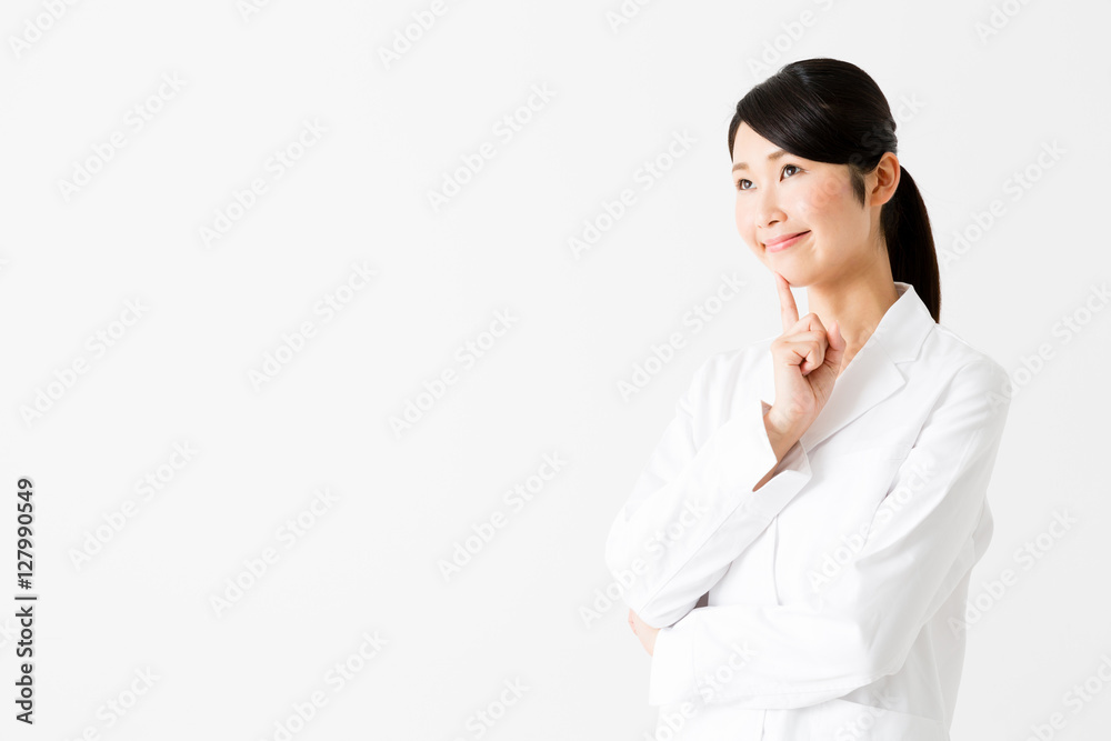 portrait of young asian doctor thinking isolated on white background