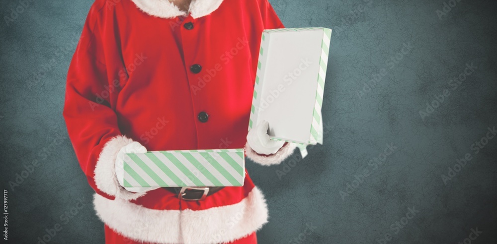 Composite image of midsection of santa claus opening gift box