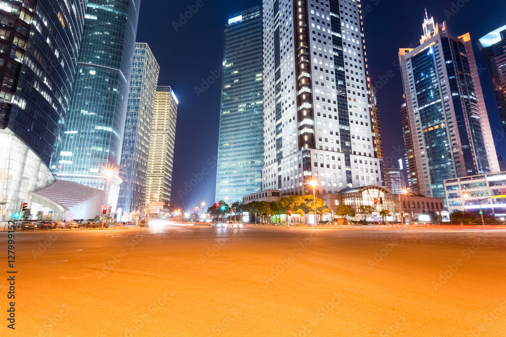 city road with futuristic buildings at night