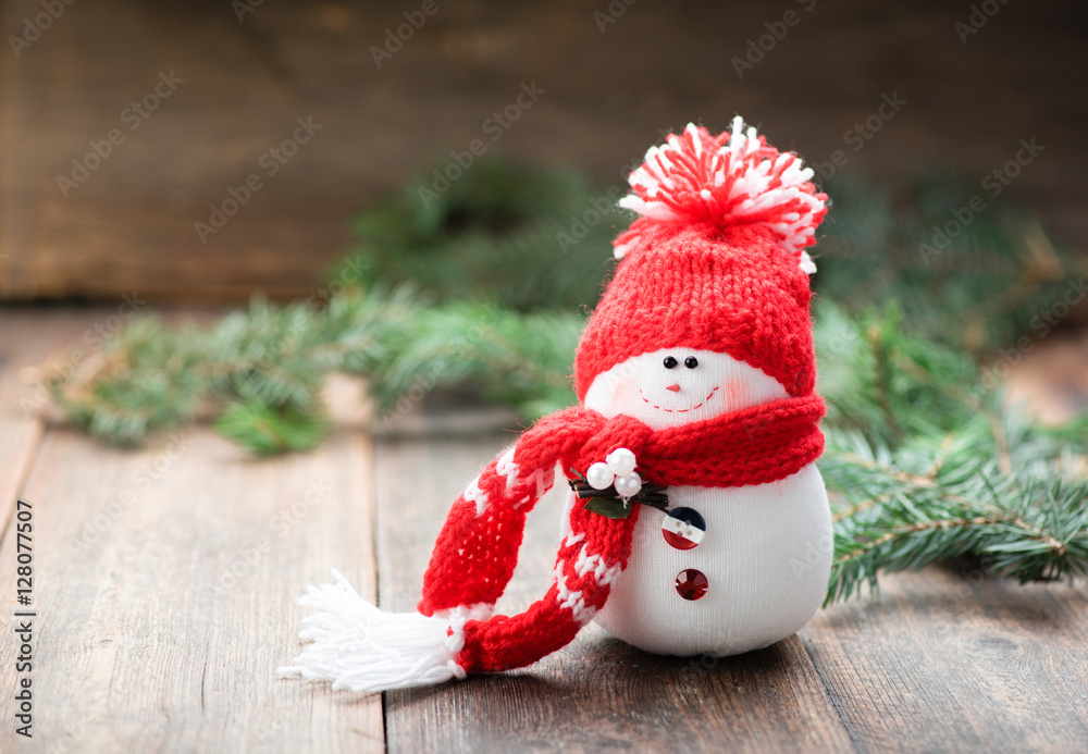 Snowman on wooden table. Christmas decoration. Copy space.