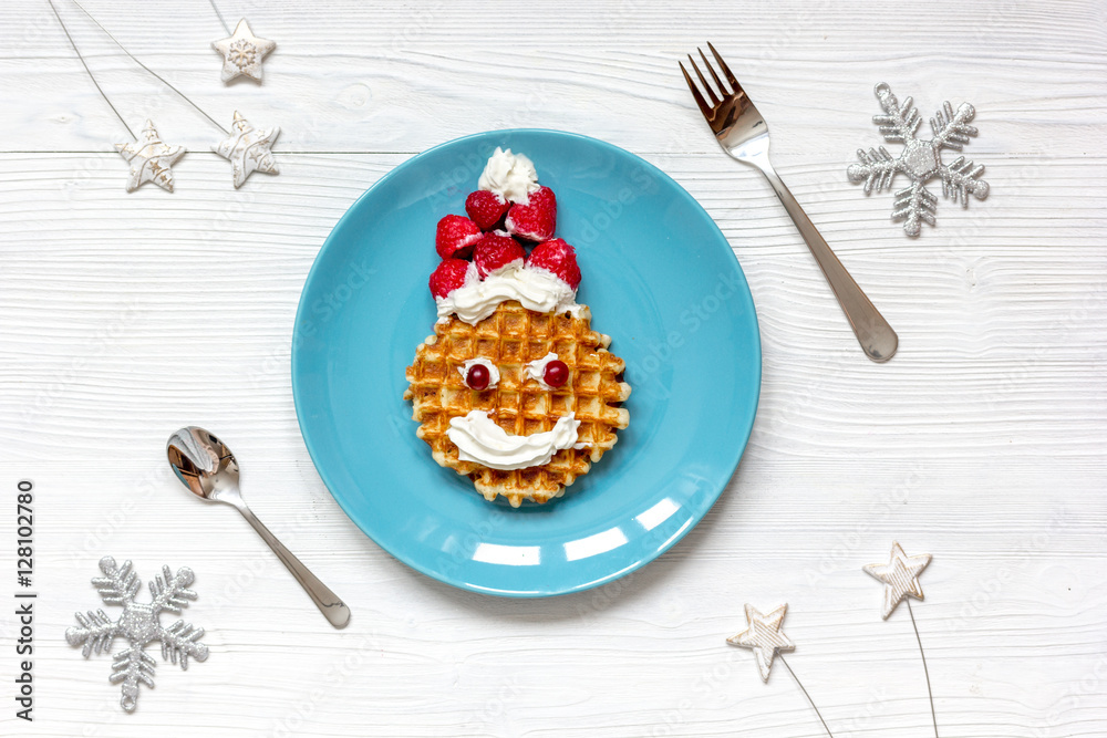 breakfast for child on Christmas with waffle top view