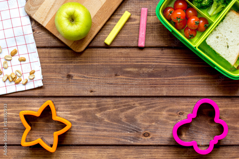 ingredients for childrens lunch on wooden background top view