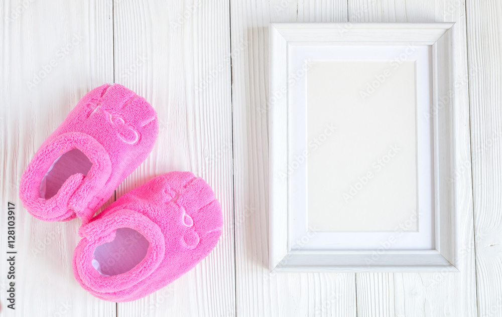 birth of child - blank picture frame on wooden background