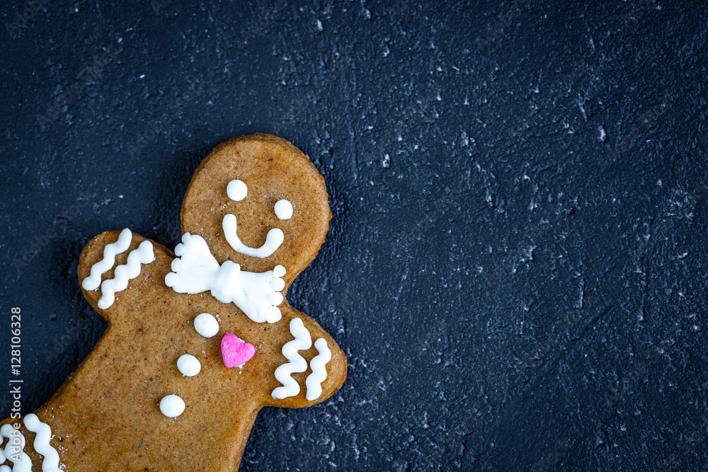 Christmas gingerbread on dark background top view