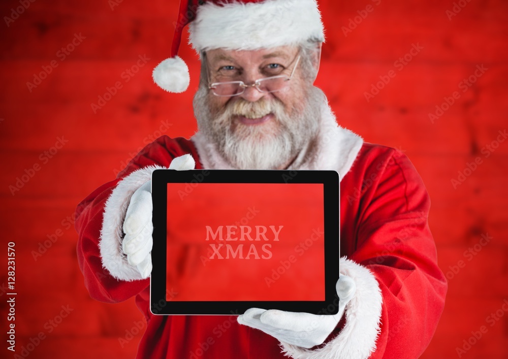 Santa claus holding a digital tablet