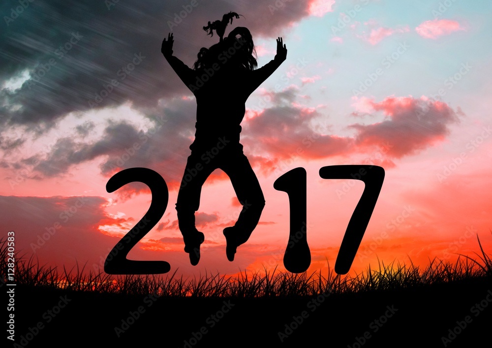 Silhouette of a jumping person forming 2017 new year sign