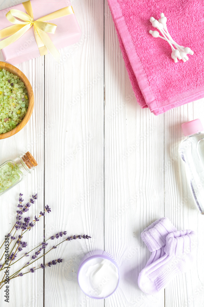 Natural organic cosmetics for baby with lavender on wooden background