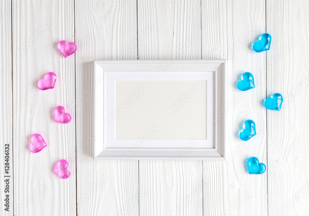 baby shower - blank picture frame on wooden background