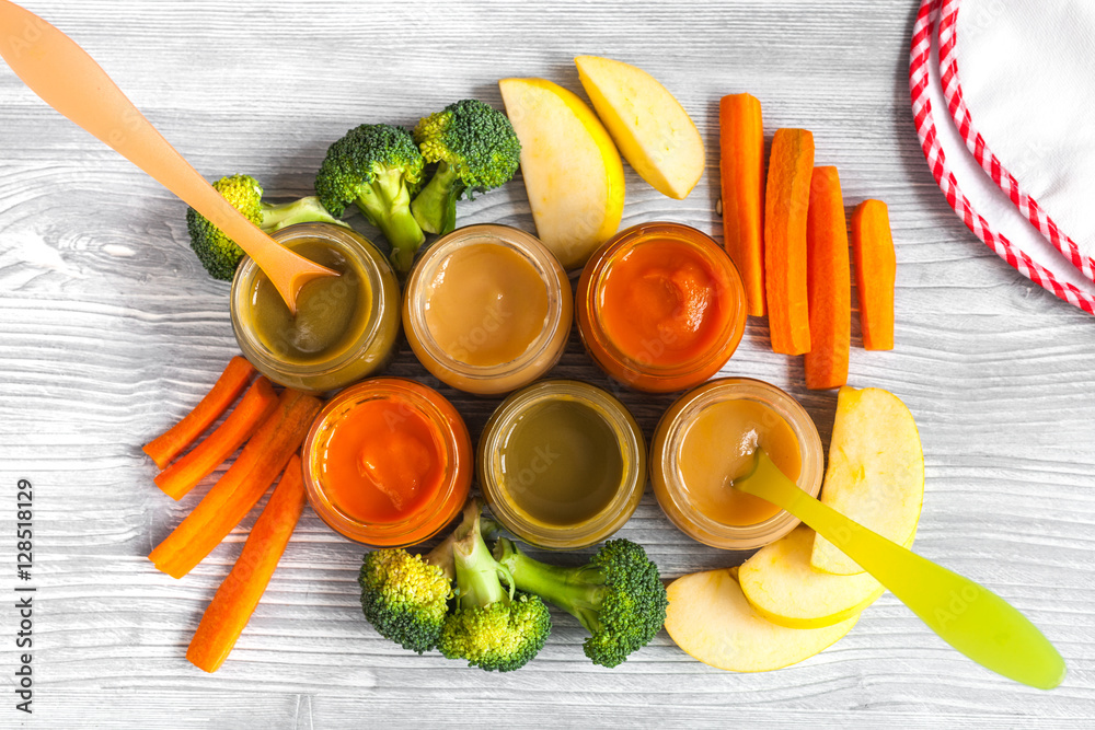 baby vegetable puree on wooden background top view