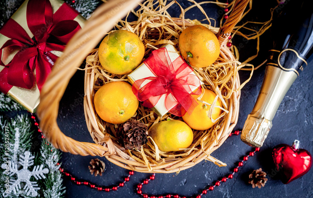 Christmas gifts and champagne with tangerines top view