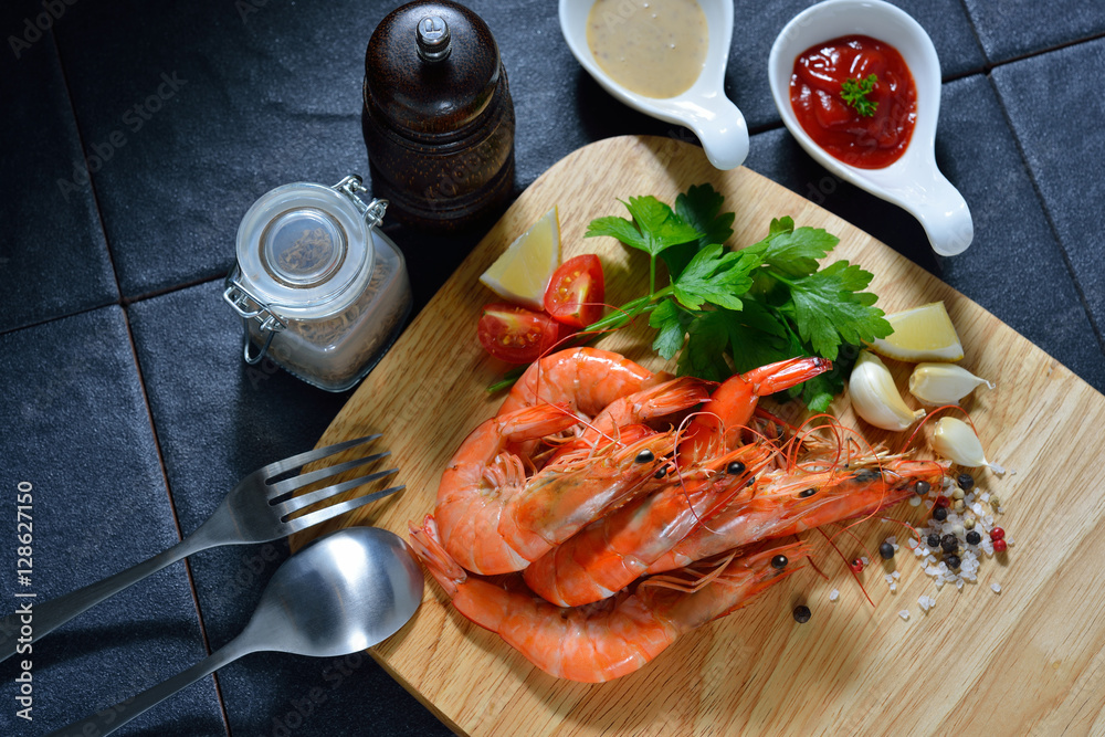 Cooked shrimps,prawns with seasonings on chopping board