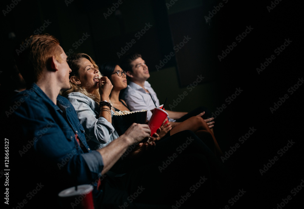 Group of people watching movie in cinema