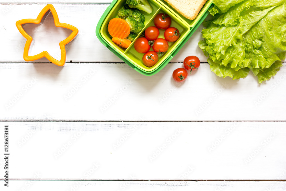 preparing lunch for child school top view on wooden background