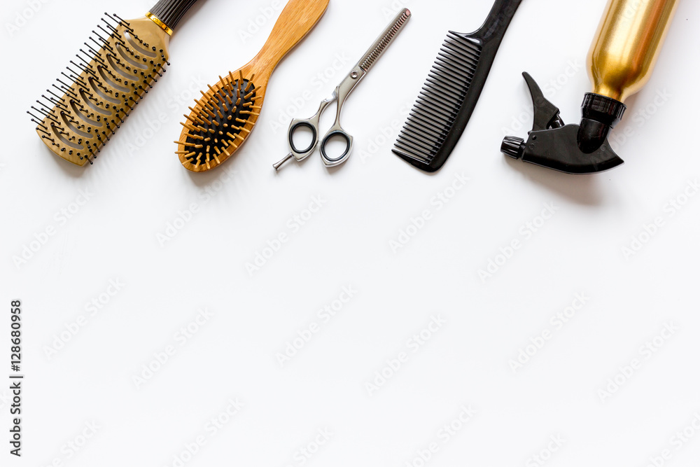 combs and hairdresser tools on white background top view