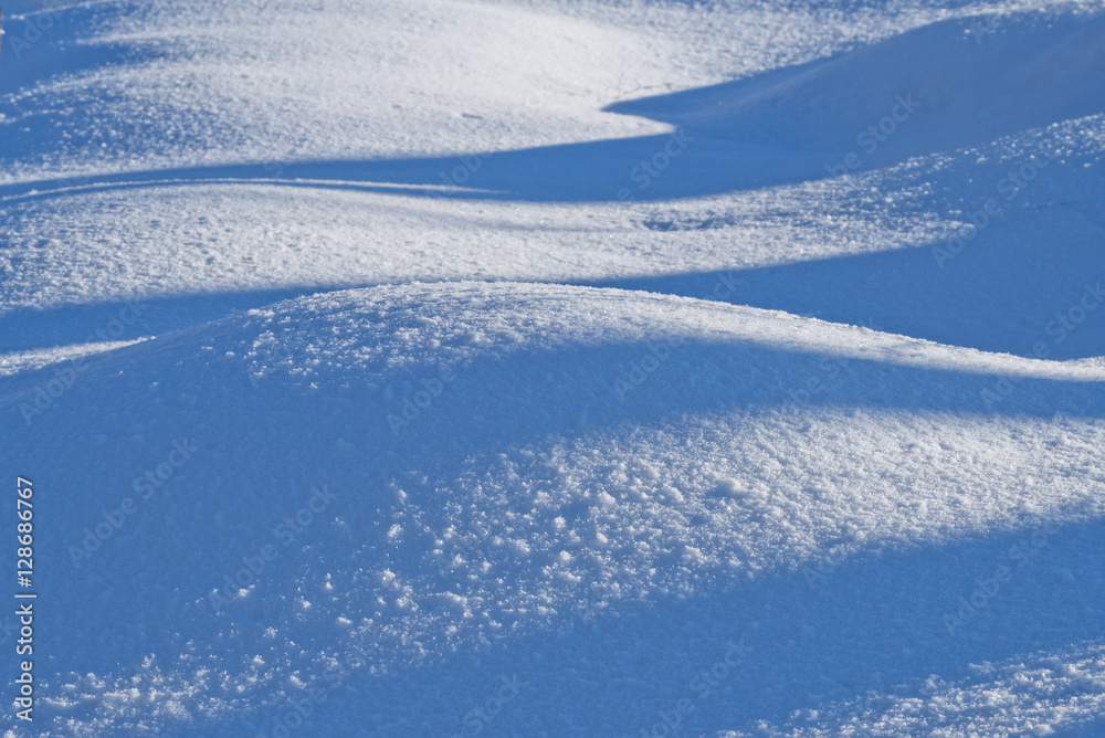  Winter nature background blue and white waves of snow drifts.