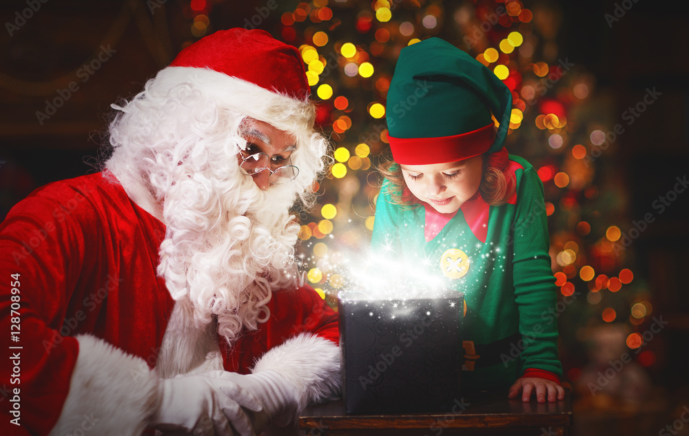 Santa Claus and helper child elf with bright magical gift in Chr