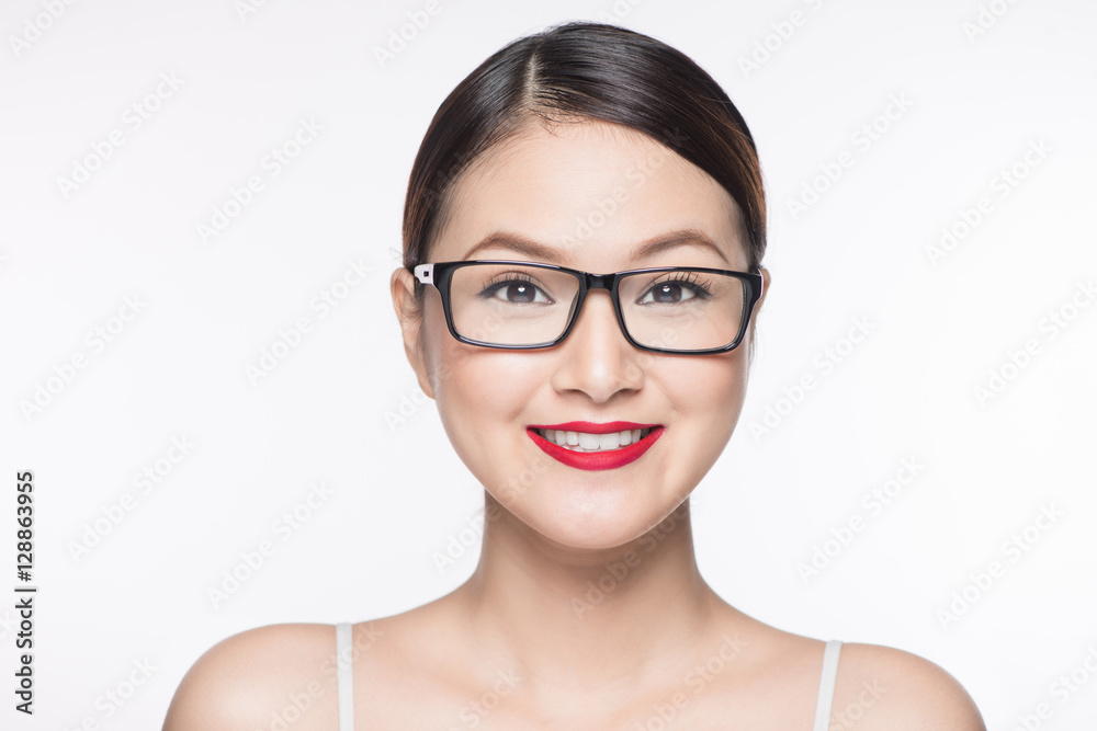 Beauty asian model girl with perfect skin wearing glasses, isola