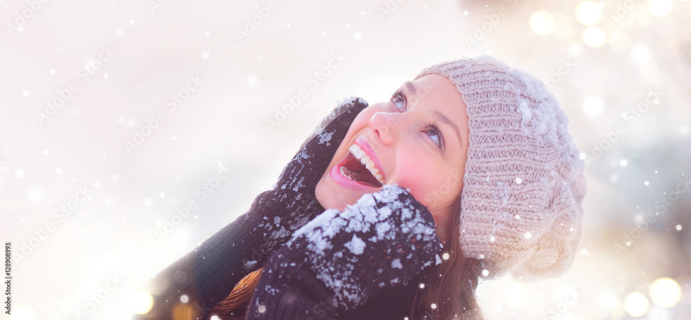 Winter girl portrait. Joyful teenage model girl having fun in winter park