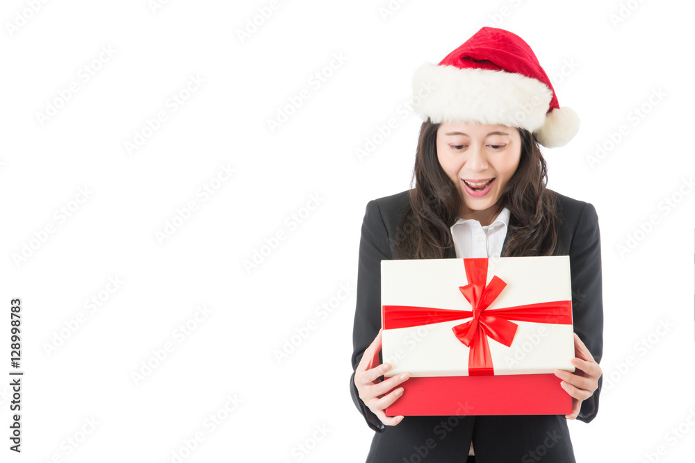 Christmas business woman opening gift surprised