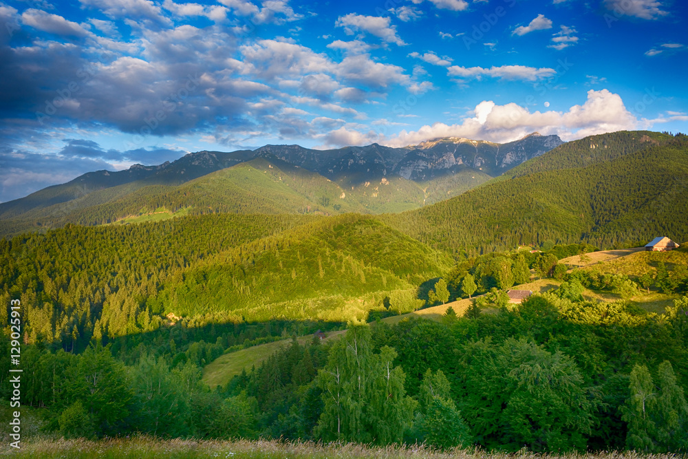 Evening, sunset on mountain hills of Simon village. Bran.