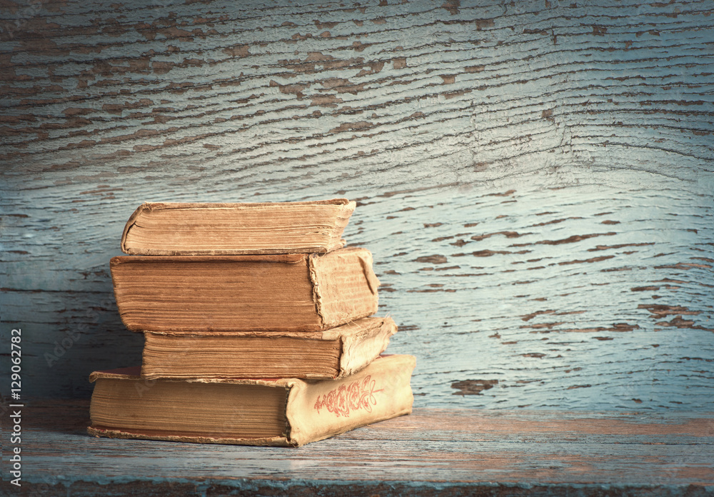 old books on a wooden background