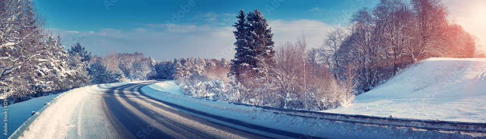 Car on winter road covered with snow