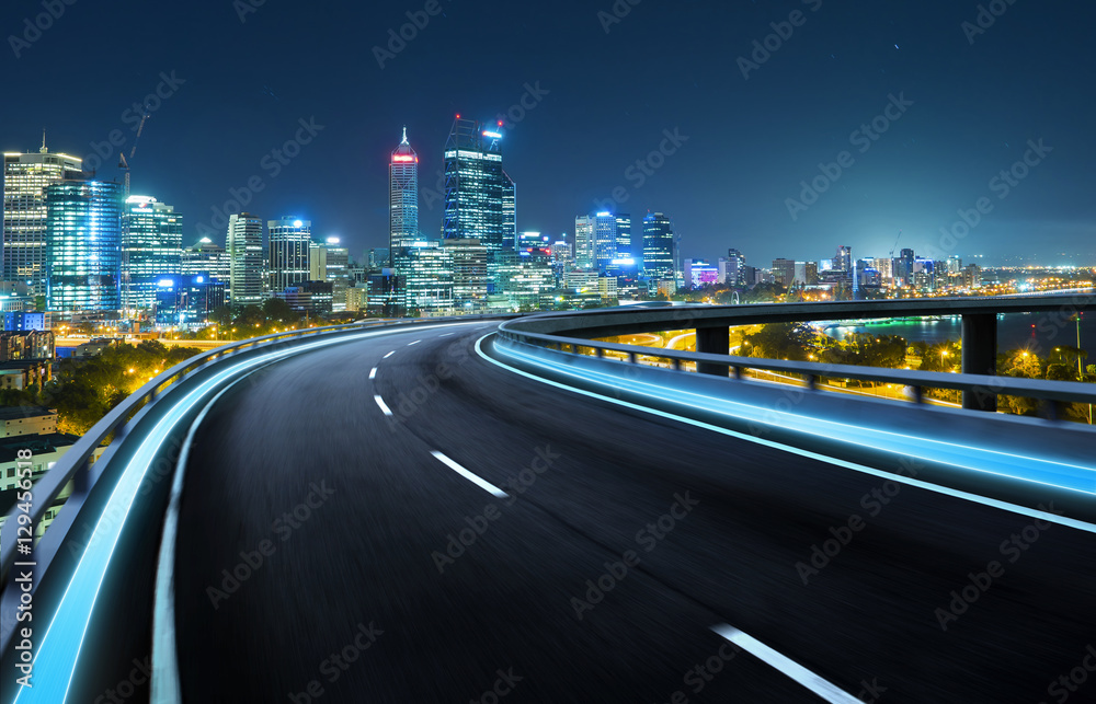 Highway overpass motion blur with city background .