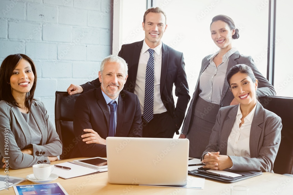 Portrait of business people smiling in conference room