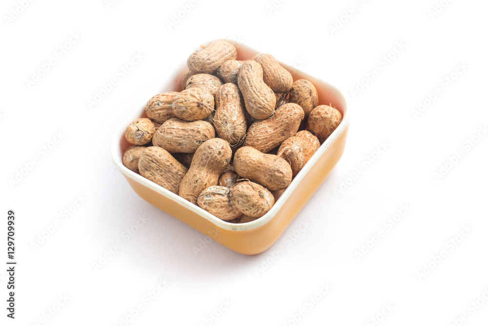 Peanuts pile. Shell Seeds into a bowl