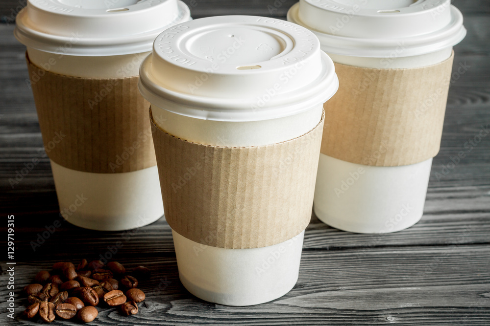 coffee cup to go at wooden background