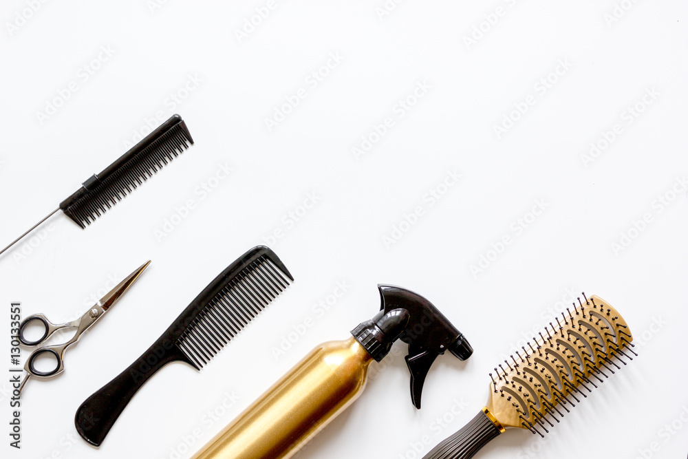 combs and hairdresser tools on white background top view