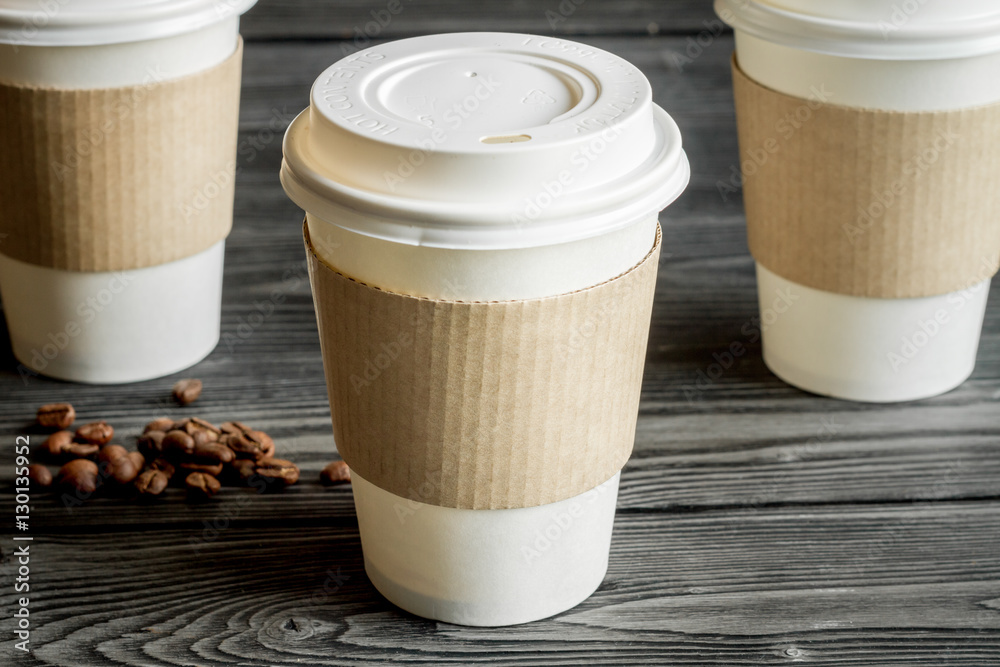 coffee cup to go at wooden background