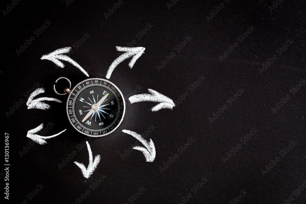 compass on dark background concept - arrows, direction top view