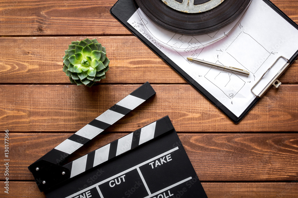 Work screenwriter on wooden background top view