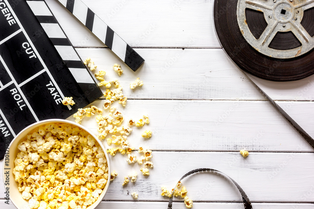 watching movie with popcorn on wooden background top view