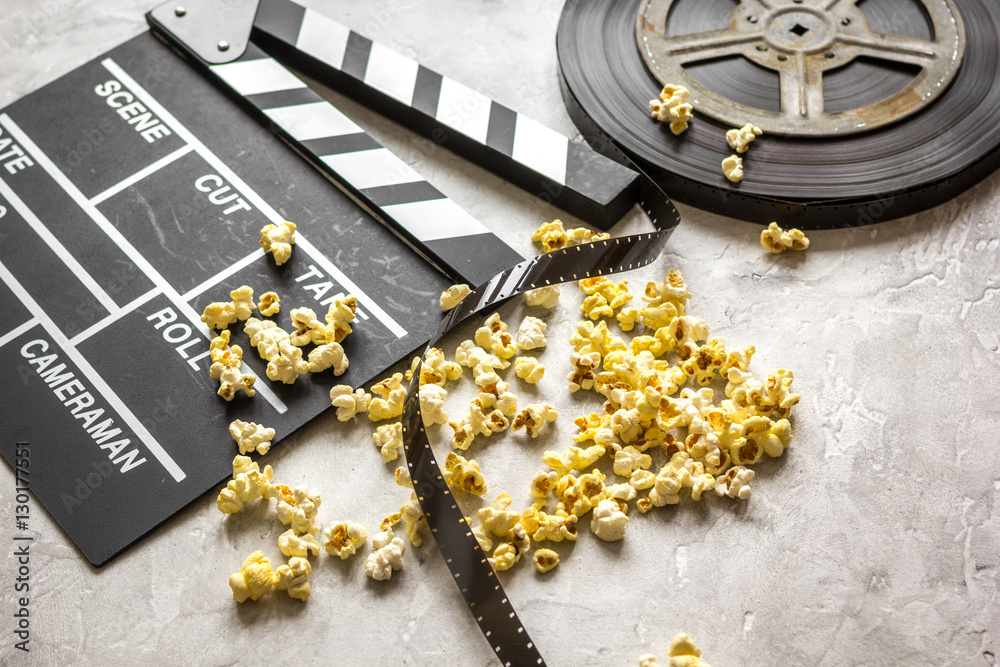 watching movie with popcorn on gray background close up