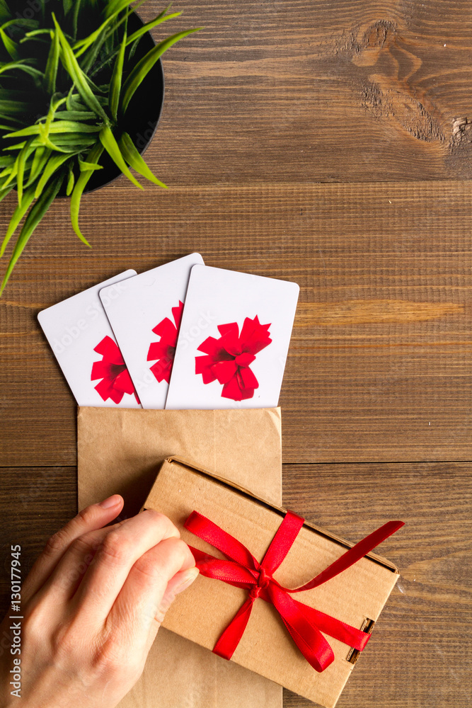 concept of gift cards on wooden background top view