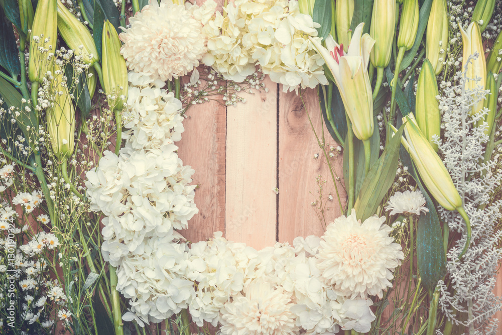 Festive flower composition with greeting card on the white woode