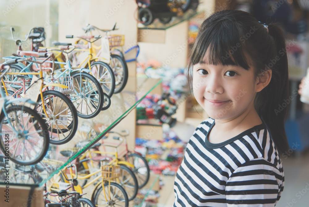 Asian girl in toys shop