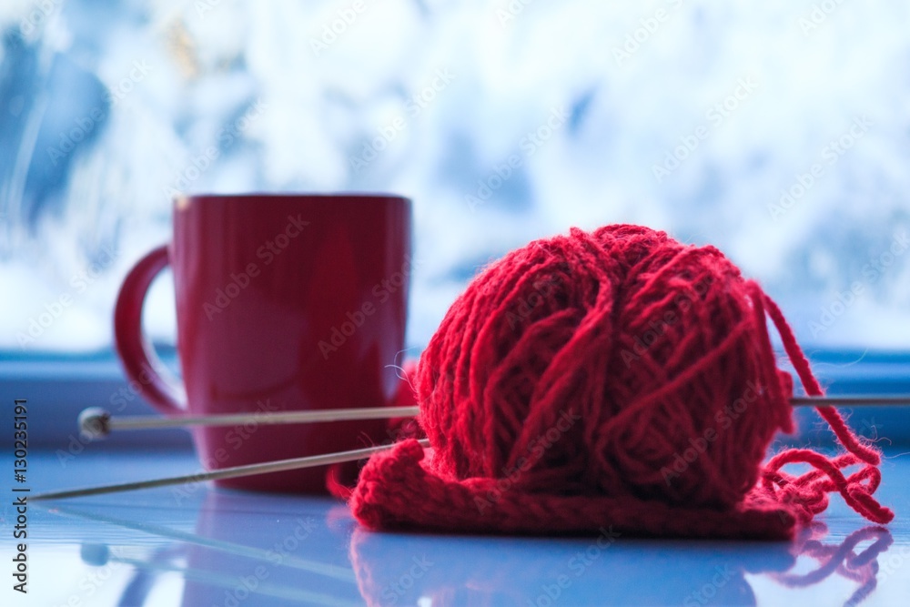 Mug of hot tea and warm woolen.